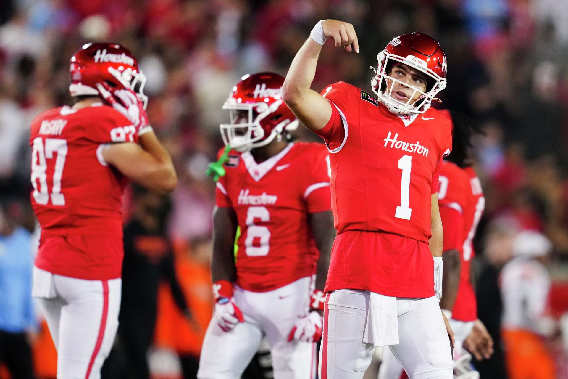 UH quarterback Conner Weigman threw five touchdown passes as the Cougars beat Oklahoma State on Saturday night in a pivotal Big 12 game between top-20 teams.