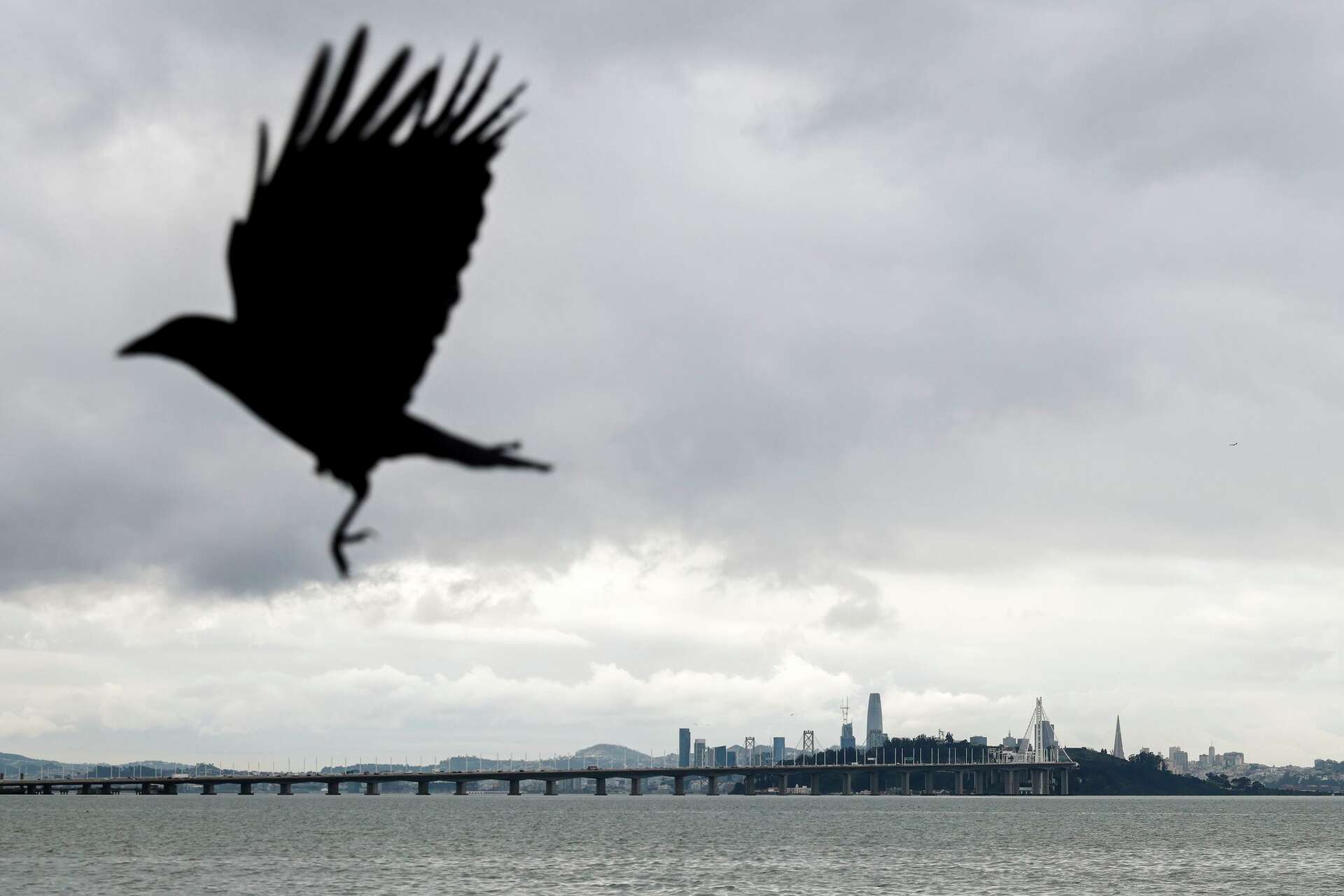 Rain clouds loom over San Francisco as seen from the Emeryville waterfront last December. Rain and cooler temperatures are forecast this week after the recent h