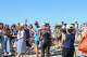 Fans and loved ones congratulate Breed on the beach.