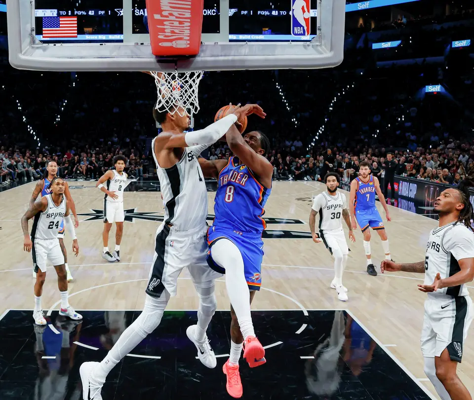 San Antonio Spurs forward Victor Wembanyama (1) attempts to block a shot by Oklahoma City Thunder guard Jalen Williams (8) during the second half of an NBA basketball game Tuesday, Oct. 20, 2026, in San Antonio. The Thunder won 116-104.