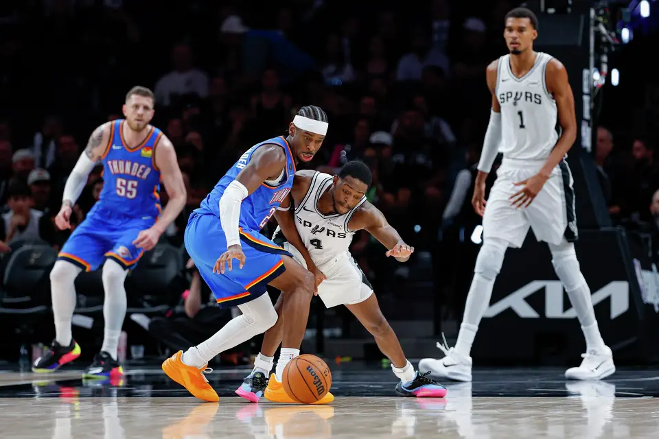 Oklahoma City Thunder guard Shai Gilgeous-Alexander (2) reacts after San Antonio Spurs guard De’Aaron Fox (4) knocks the ball from his hands during the second half of an NBA basketball game Tuesday, Oct. 20, 2026, in San Antonio. The Thunder won 116-104.