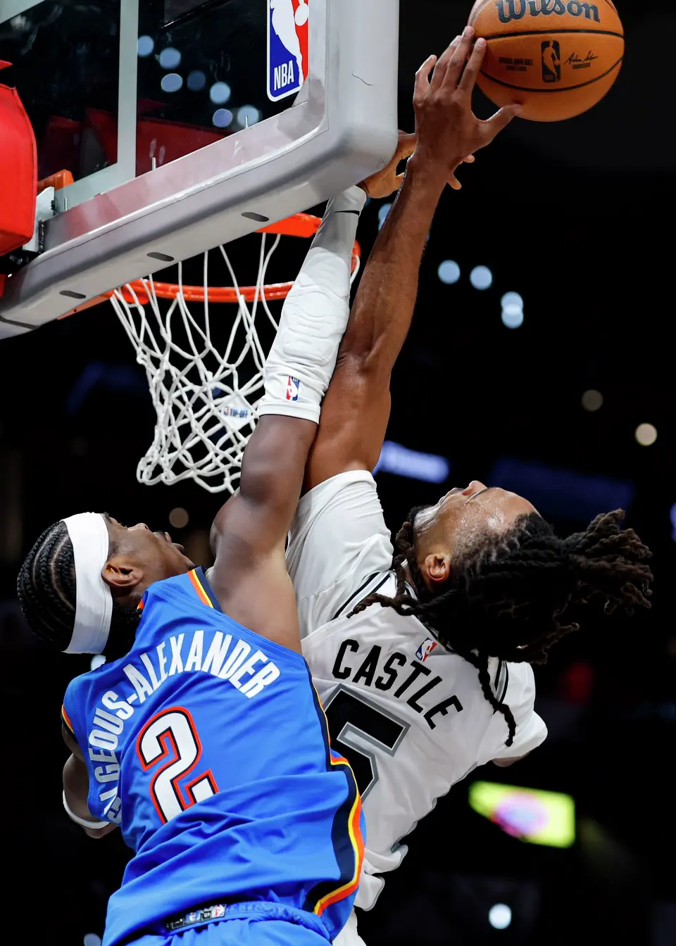 Oklahoma City Thunder guard Shai Gilgeous-Alexander (2) blocks San Antonio Spurs guard Stephon Castle (5) at the rim during the second half of the NBA season opener at Frost Bank Center in San Antonio, Tuesday, Oct. 20, 2026. The Spurs fell to the Thunder 116-104.