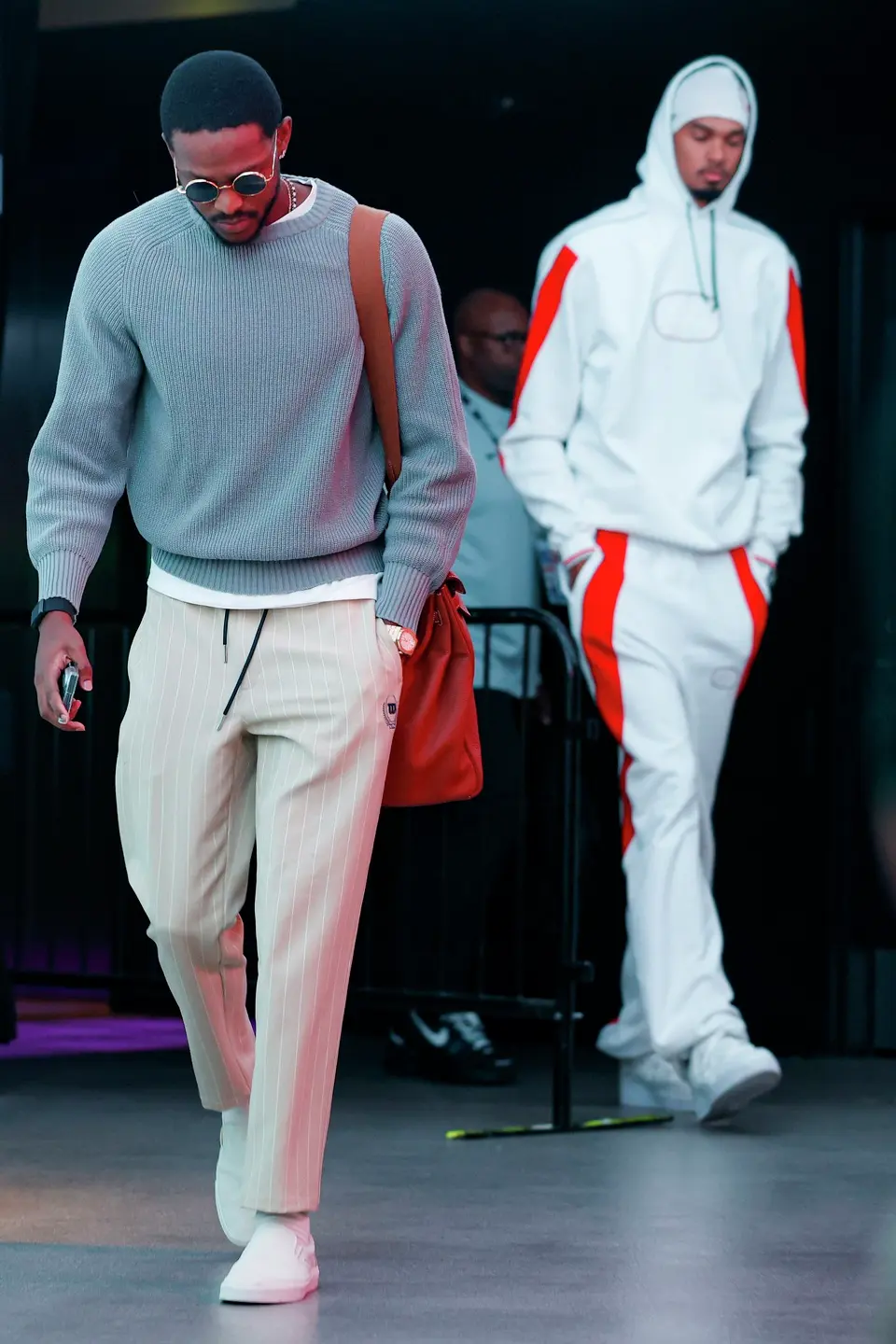 San Antonio Spurs guard De'aaron Fox, left, and San Antonio Spurs forward Victor Wembanyama walks into the Moody Center in Austin, Friday, Oct. 23, 2026, before an NBA game against the Houston Rockets.