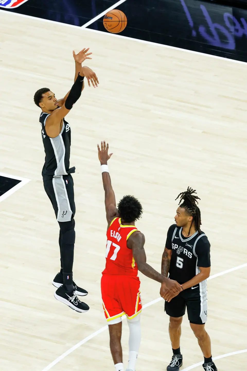 San Antonio Spurs forward Victor Wembanyama (1) makes a 3-pointer during the second quarter against the Houston Rockets at Moody Center in Austin, Friday, Oct. 23, 2026.