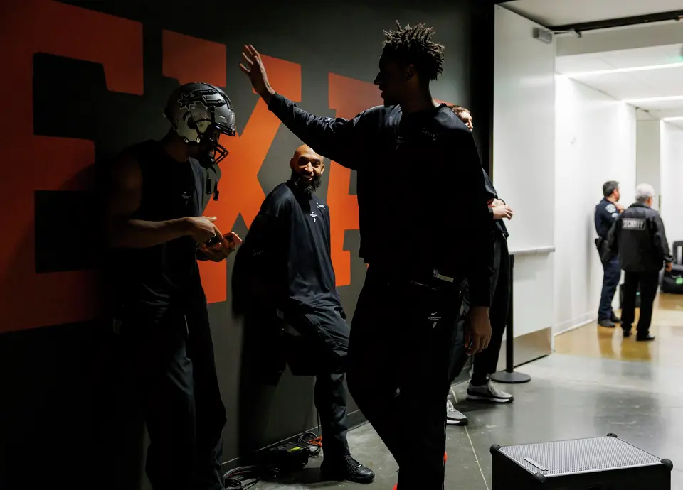 San Antonio Spurs center Tarris Reed Jr., center, taps forward Keldon Johnson (3) on the head as they prepare for an NBA game against the Houston Rockets at Moody Center in Austin, Friday, Oct. 23, 2026.