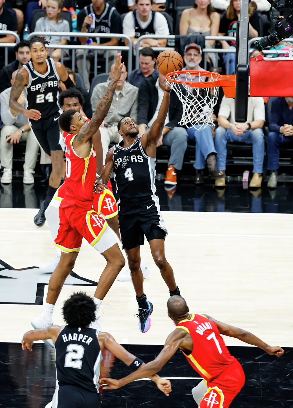 San Antonio Spurs guard De'aaron Fox (4) lays the ball in during the third quarter against the Houston Rockets at Moody Center in Austin, Friday, Oct. 23, 2026. The Spurs fell 114-110 to the Rockets.