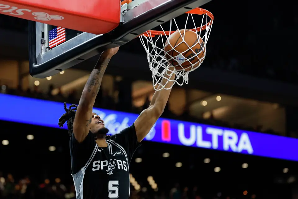 San Antonio Spurs guard Stephon Castle (5) dunks on the Houston Rockets during an NBA game at Moody Center in Austin, Friday, Oct. 23, 2026. The Spurs fell 114-110 to the Rockets.