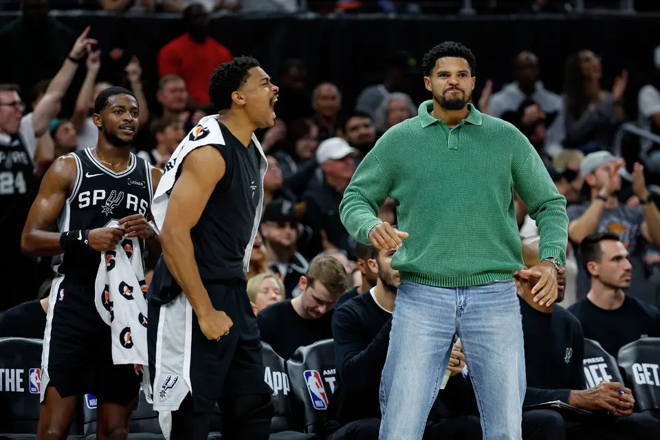 San Antonio Spurs guard De’Aaron Fox, from left, and forwards Keldon Johnson and Tobias Harris react to a dunk by teammate Stephon Castle, not pictured, against the Houston Rockets during the fourth quarter at the Moody Center in Austin, Texas, Friday, Oct. 23, 2026. The Rockets won 114-110.
