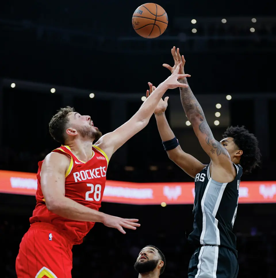 San Antonio Spurs guard Dylan Harper (2) shoots over Houston Rockets center Alperen Sengun (28) during the fourth quarter at Moody Center in Austin, Friday, Oct. 23, 2026. The Spurs fell 114-110 to the Rockets.
