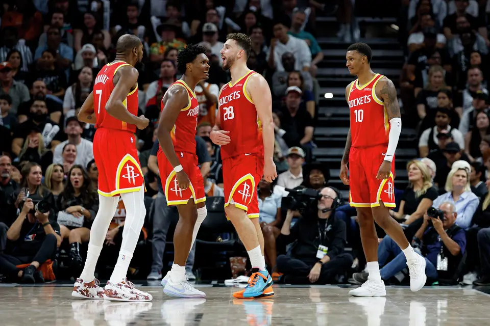 Houston Rockets forward Kevin Durant (7), guard Amen Thompson (1) and forward Jabari Smith Jr. (10) react to a play made by center Alperen Sengun (28) against the San Antonio Spurs at the Moody Center in Austin, Texas, Friday, Oct. 23, 2026. The Rockets won 114-110.