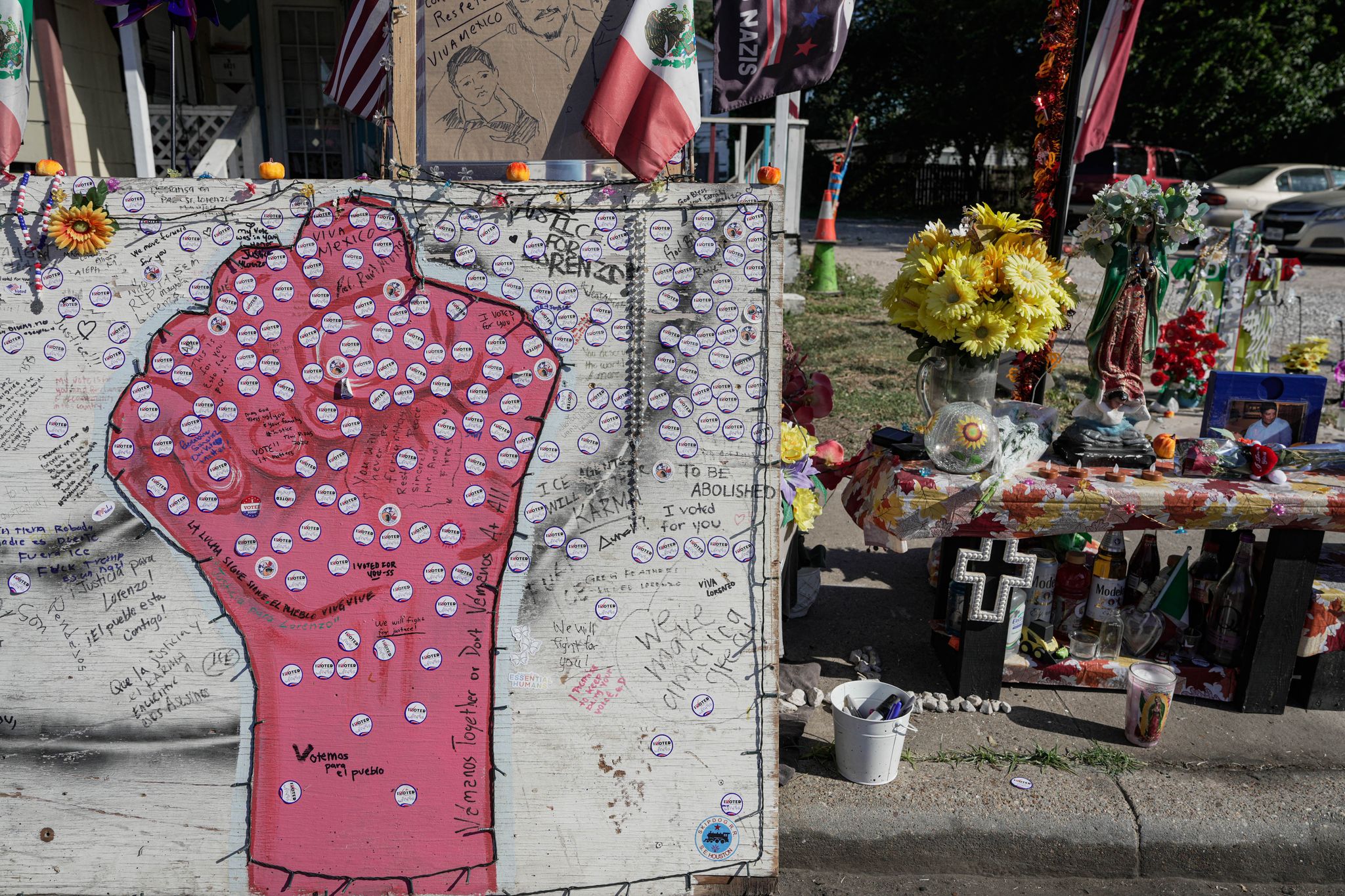 Voters leave stickers at site where ICE killed Lorenzo Salgado Araujo
