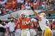 Miami quarterback Darian Mensah (10) throws a pass as Pittsburgh defensive lineman Zach Crothers (5) defends during the first half of an NCAA college football game, Saturday, Oct. 24, 2026, in Miami Gardens, Fla.