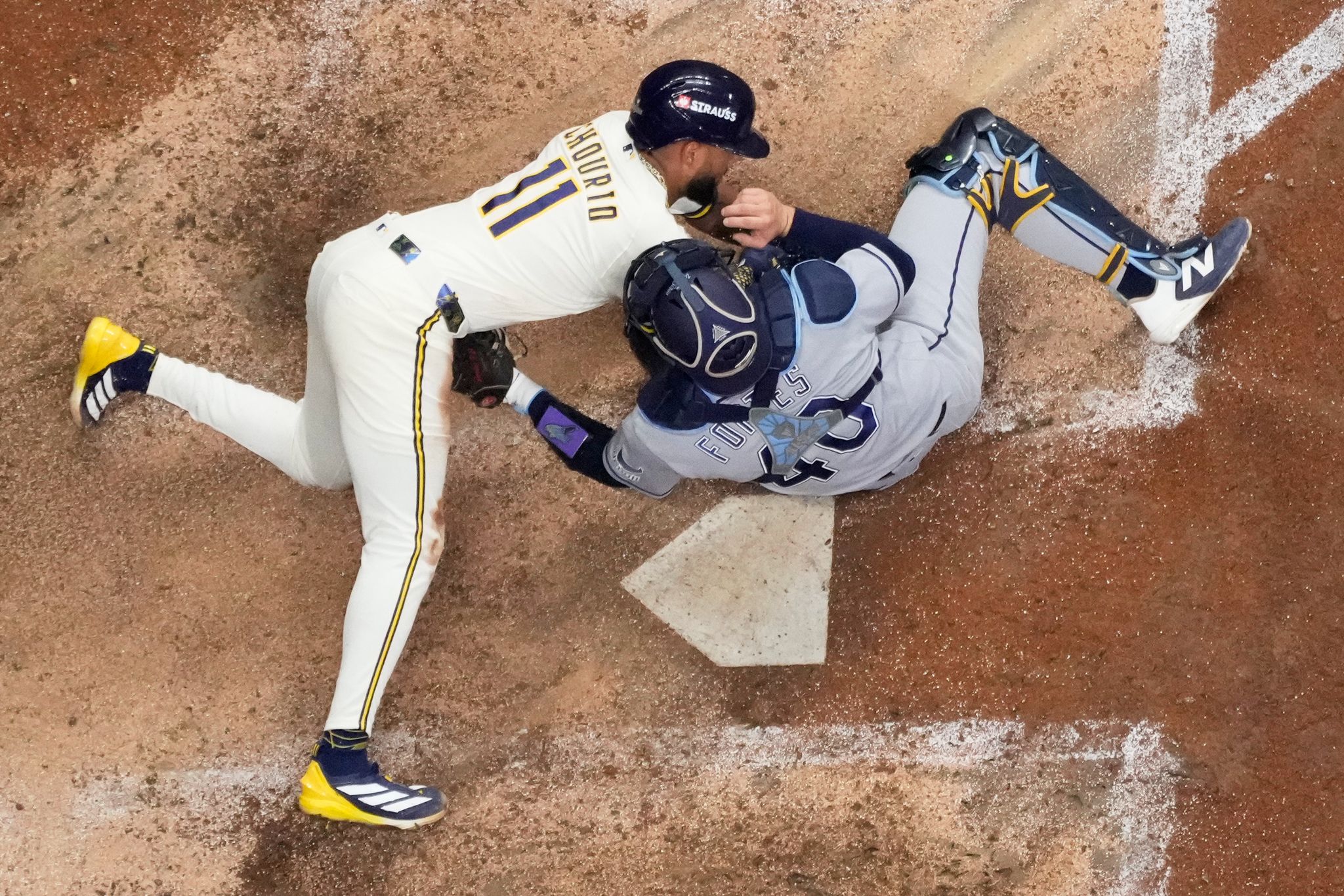 Photos of the Brewers and Rays battling for their first World Series title