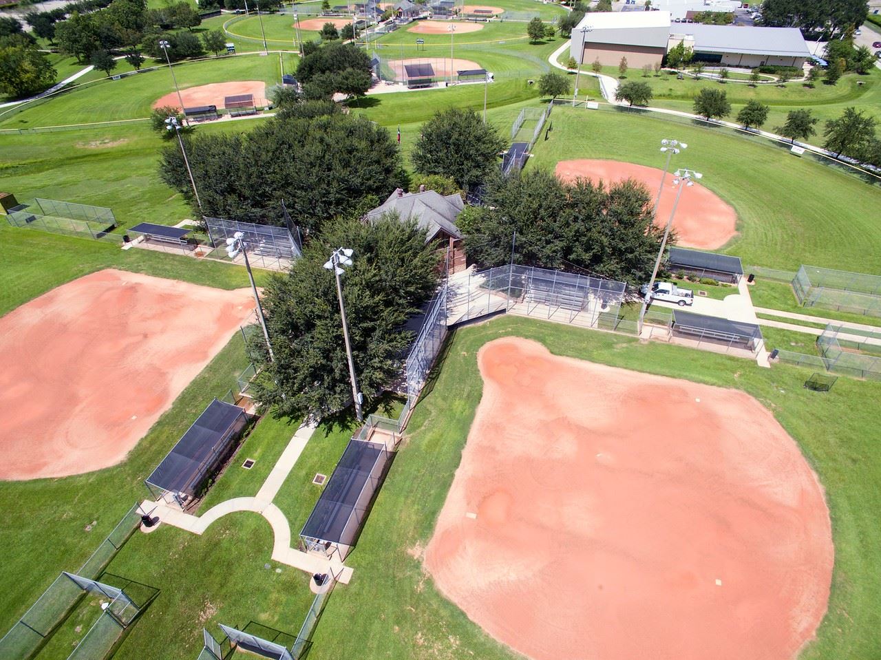 A married couple was arrested in Sugar Land after a dispute over cheering at a youth softball game led to fisticuffs, injuries and criminal charges.
