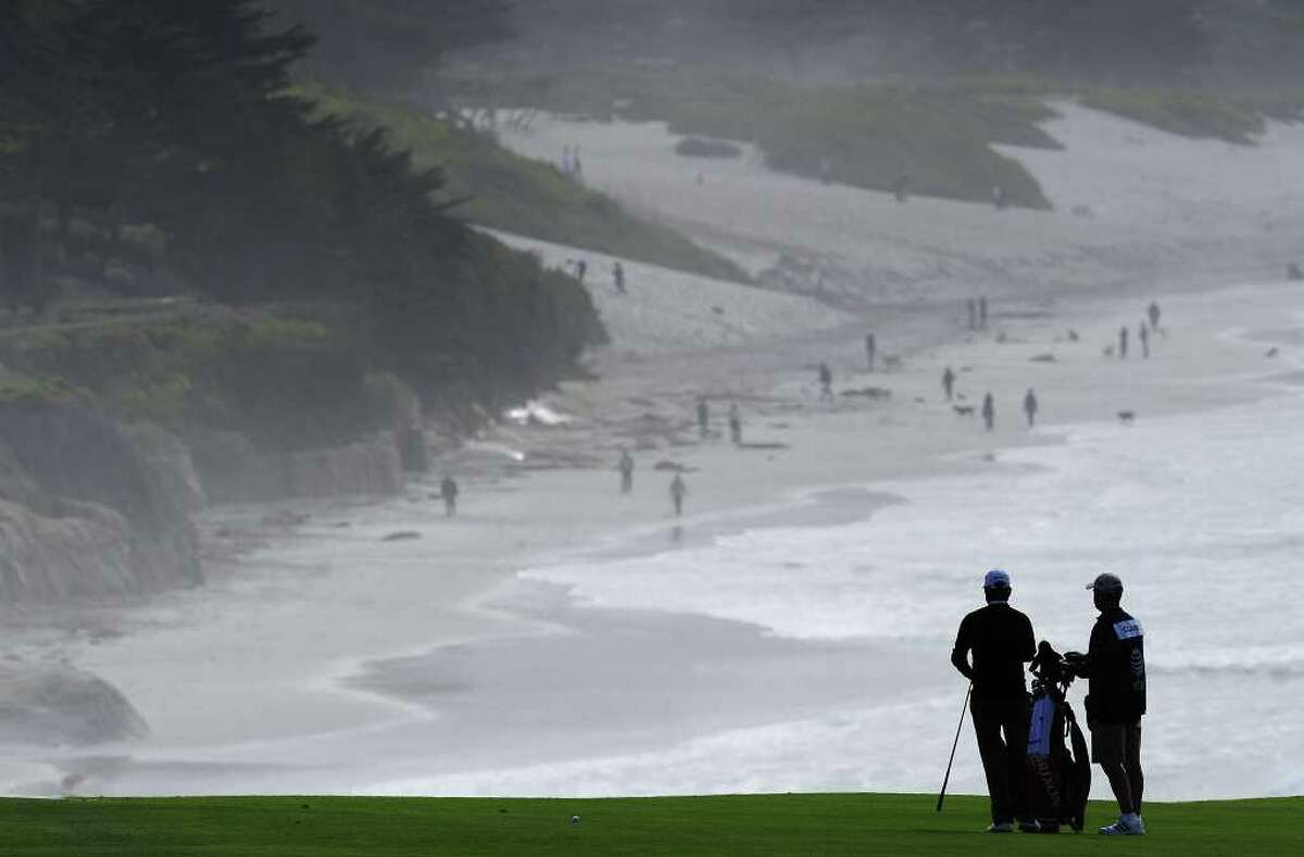 PEBBLE BEACH, CA - FEBRUARY 12: Tim Clarke of South Africa and caddie on the nineth hole during round two of the AT&T Pebble Beach National Pro-Am at Pebble Beach Golf Links on February 12, 2010 in Pebble Beach, California. (Photo by Stuart Franklin/Getty Images) *** Local Caption *** Tim Clarke