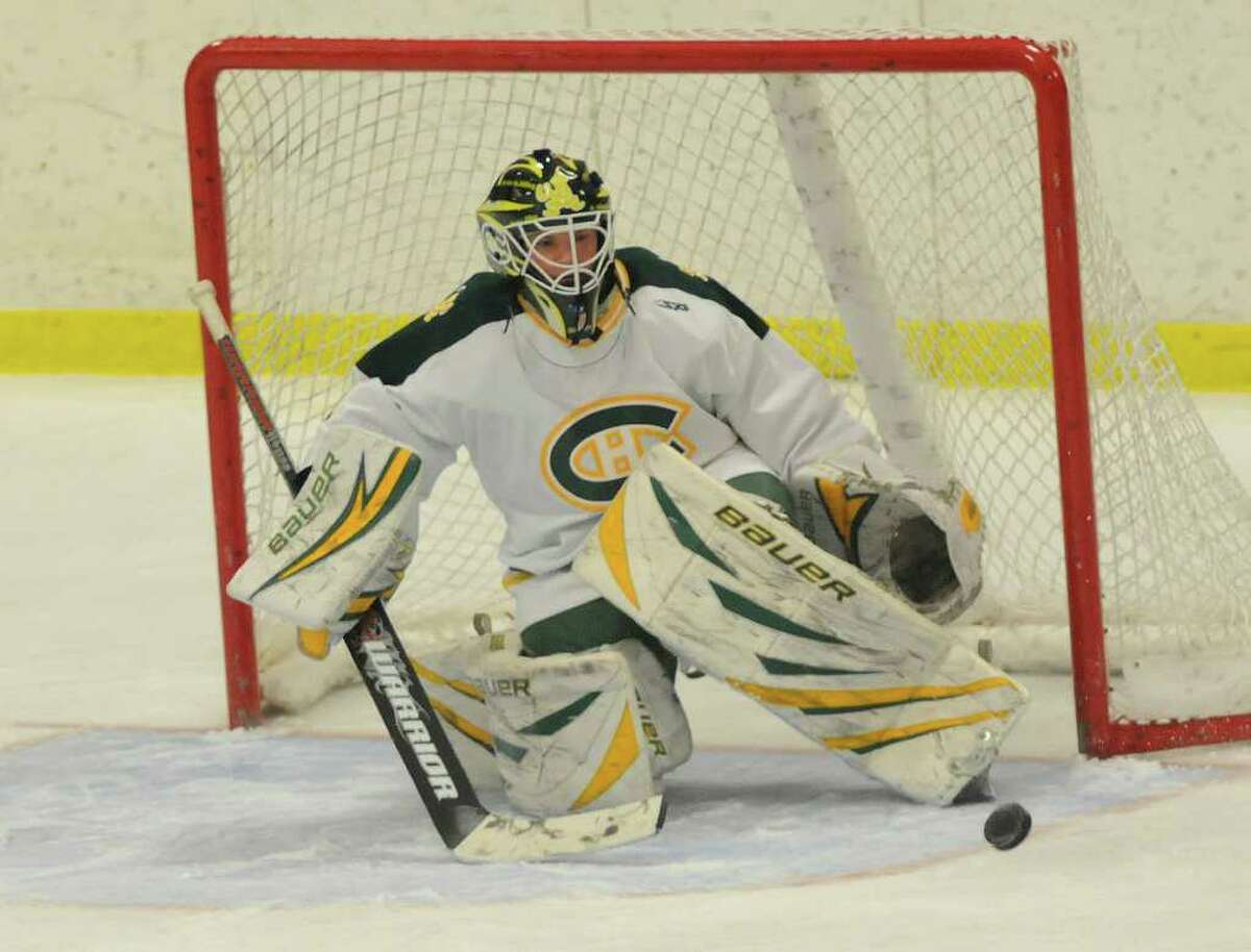Trinity Goalie #1 Brian Romano is ready to fend off a shot as Notre Dame - West Haven challenges Trinity Catholic High School at Terry Conners Rink in Stamford, CT on Tuesday December 28, 2010.
