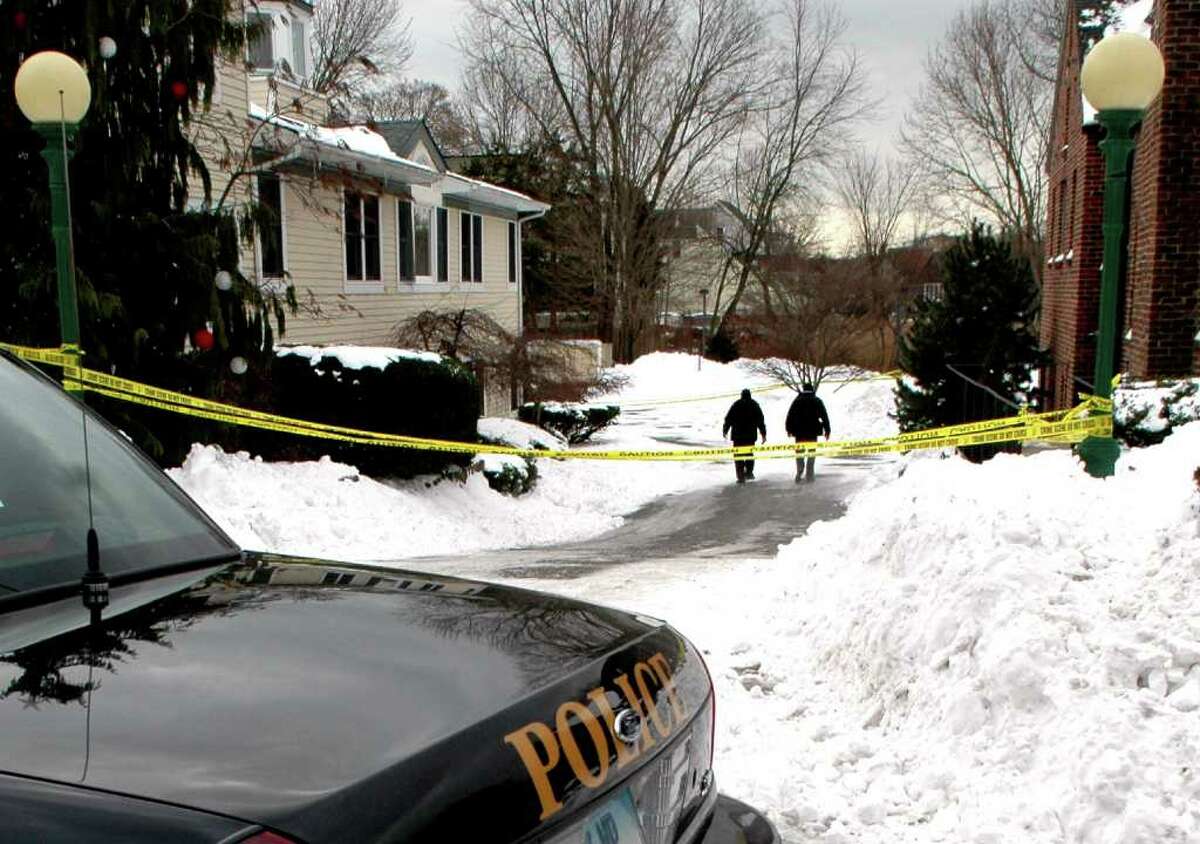 Westport police at the scene early Tuesday morning, December 28, 2010, where the body of Cynthia D'Aiuto, 48, was found at 166 Kings Highway North in the parking lot of a commercial complex. The state medical examiner's office has ruled her death was accidental. A Connecticut Post newspaper carrier stumbled onto what he described as a horror scene as he discovered the body in the snow while delivering the paper at around 5:30 a.m.