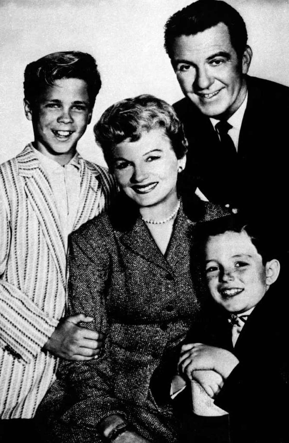 FILE - In this undated file photo, from left, Tony Dow as Wally, Barbara Billingsley as June, Hugh Beaumont as Ward and Jerry Mathers as Beaver, the cast of the TV series "Leave It to Beaver", pose for a publicity portrait. Billingsley, who gained the title supermom for her gentle portrayal of June Cleaver, the warm, supportive mother of a pair of precocious boys in "Leave it to Beaver," has died Saturday, Oct. 16, 2010. She was 94. (AP Photo/File)