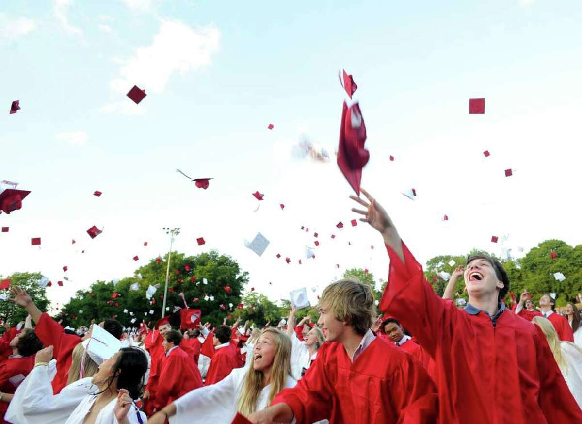 T.J. Franco, right, and classmates throw their graduation caps into the air at the end of the Greenwich High School 2010 graduation ceremony, Tuesday evening, June 29, 2010. 6/30/10 GT photo = Looking to the future. GHS graduation: 690 students say goodbye. by Colin Gustafson