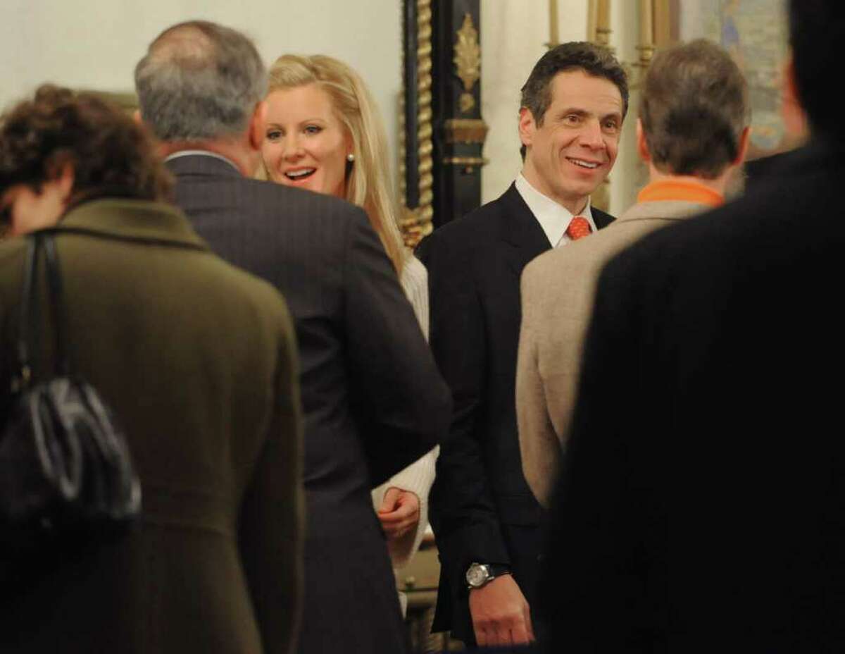 Albany County Executive Michael Breslin is greeted by Sandra Lee while Governor Andrew Cuomo greets another person at the Executive Mansion in Albany, NY on January 1, 2011. (Lori Van Buren / Times Union)