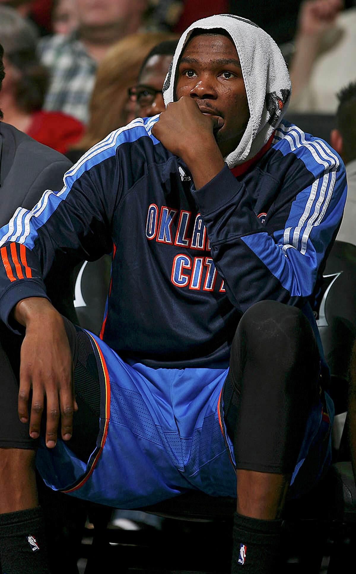 Thunder's Kevin Durant sits dejected on the bench against the Spurs during second half action Saturday.