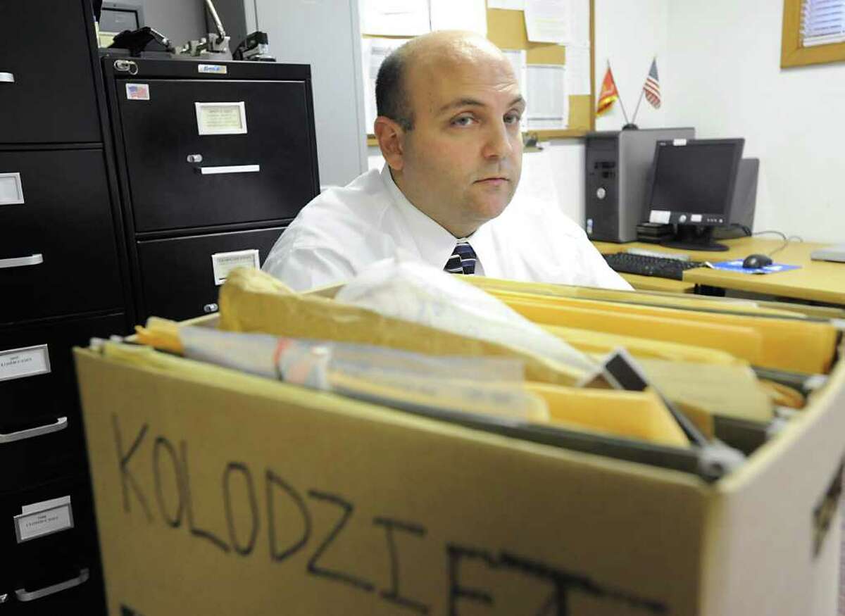 State Police BCI Investigator Tom Cioffi talks about the1974 homicide of Katherine Kolodziej. Her case files sit next to him at Princetown State Police Station in Schenectady. (Lori Van Buren / Times Union)