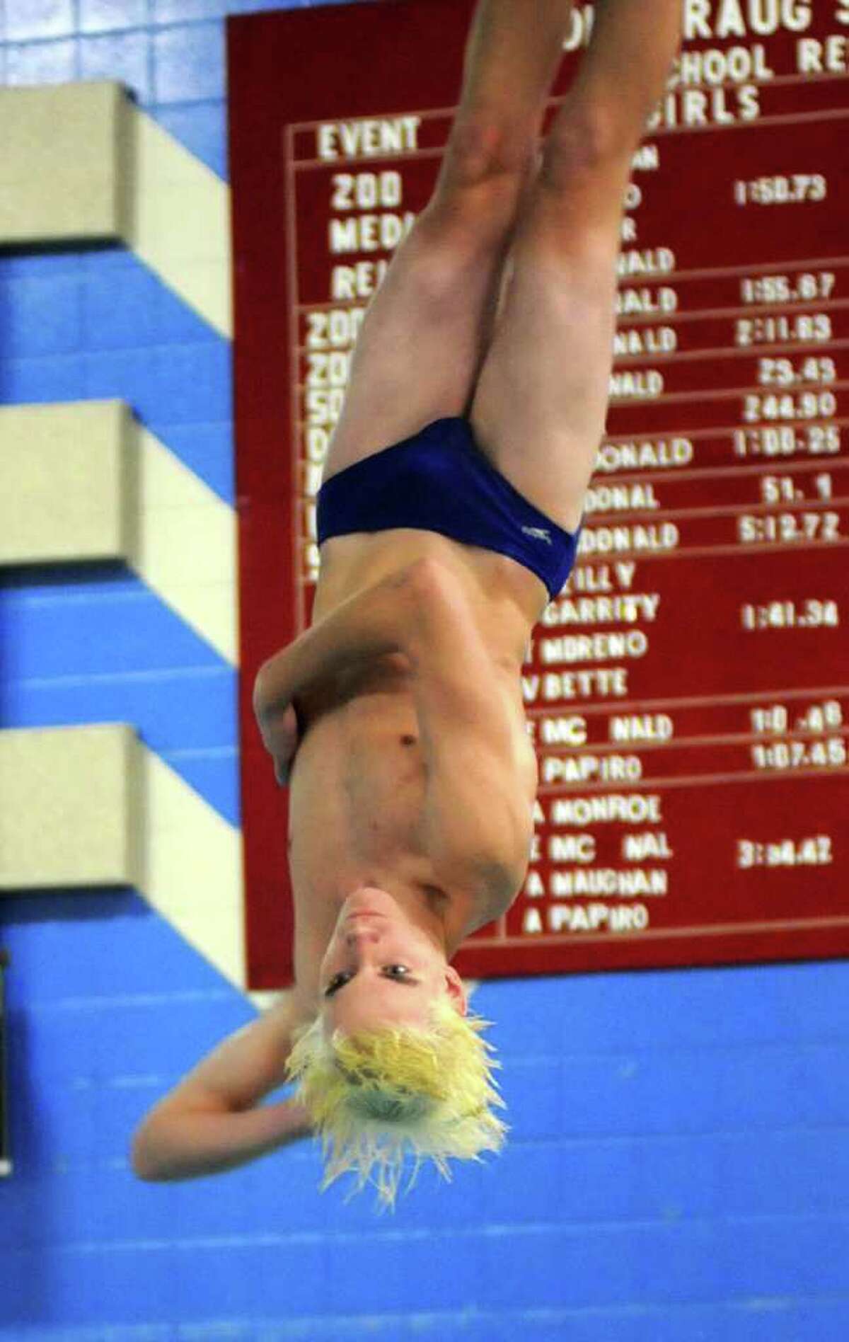 Danny Dixon dives for Brookfield at Pomperaug's swim meet on Tuesday Jan. 4, 2011.