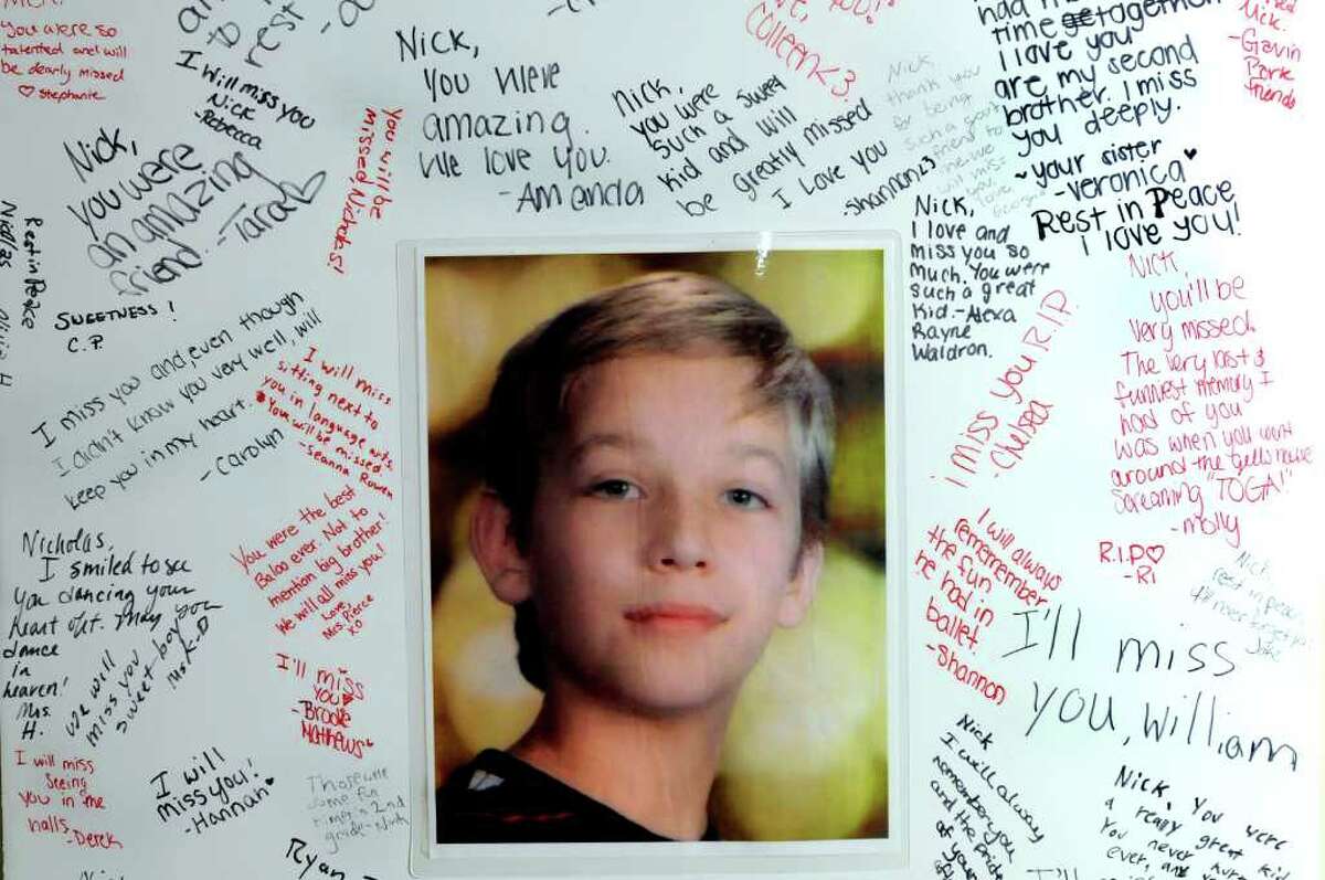 A poster of Nicholas Naumkin, who was killed Dec. 22 after a friend shot him accidentally with a handgun, with signatures from classmates and teachers on Saturday, Jan. 1, 2011, at the Naumkin home in Wilton, N.Y. (Cindy Schultz / Times Union archive)