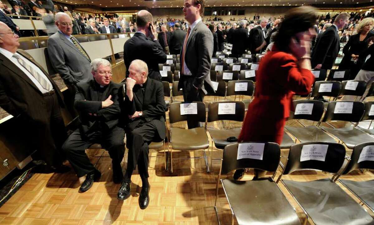 Rev. Kenneth Doyle, left, and Albany Roman Catholic Diocese Bishop Howard Hubbard chat in the Convention Center of the Empire State Plaza in Albany before Gov. Andrew Cuomo's first State of the State speech January 5, 2011. (Skip Dickstein / Times Union)