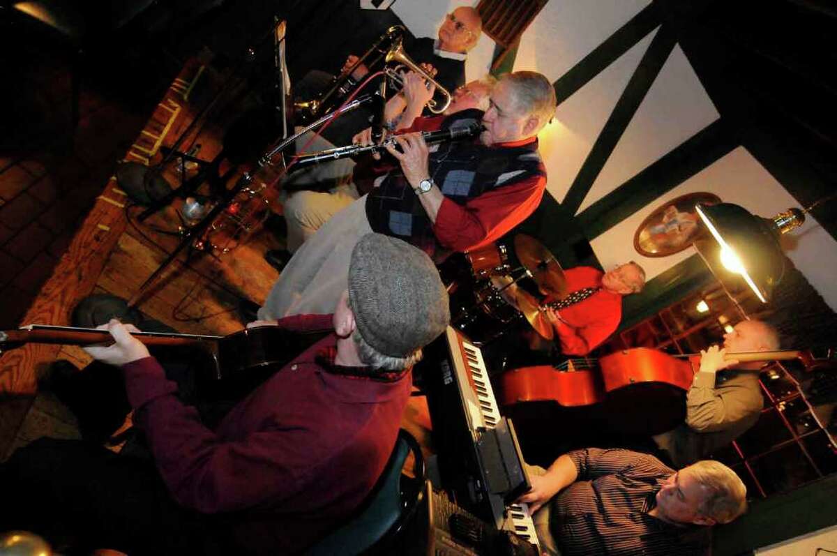 Skip Parsons, center, and his Riverboat Jazz Band take a break during a performance at Fountain Restaurant in Albany. (Michael P. Farrell / Times Union)