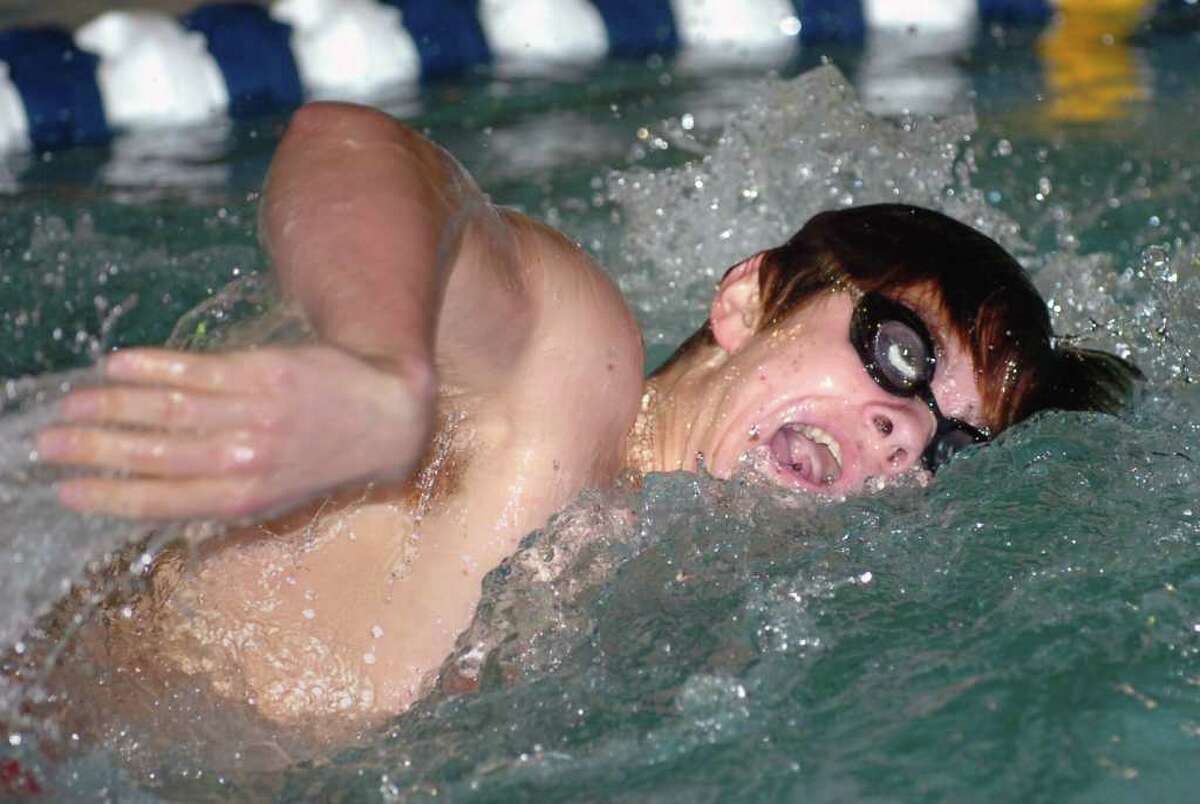 Andrew Dillinger of Greenwich High School competes in the 200 yard freestyle event during boys swimming meet between Greenwich High School and New Canaan High School at the New Canaan YMCA, Wednesday afternoon, Jan. 5, 2011.