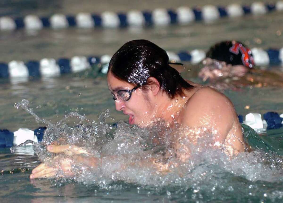 Tony Martir of Greenwich High School swims the breast stroke leg of the 200 yard medley relay during boys swimming meet between Greenwich High School and New Canaan High School at the New Canaan YMCA, Wednesday afternoon, Jan. 5, 2011.