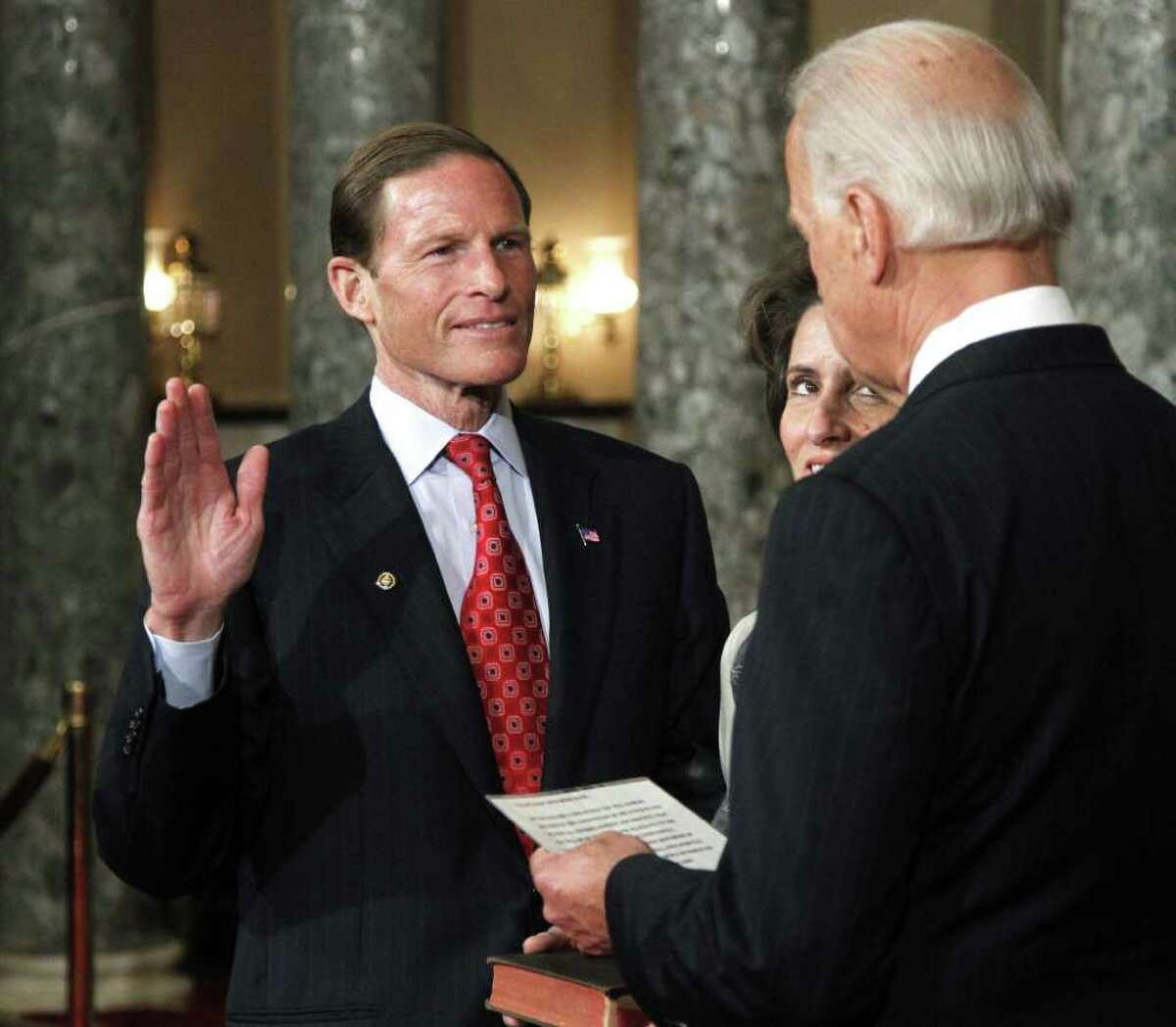 Vice President Joe Biden administers a ceremonial Senate oath during a mock swearing-in ceremony to Sen. Richard Blumenthal, D-Conn., left, accompanied by his wife Cynthia, Wednesday, Jan. 5, 2011, in the Old Senate Chamber on Capitol Hill in Washington. (AP Photo/Manuel Balce Ceneta)