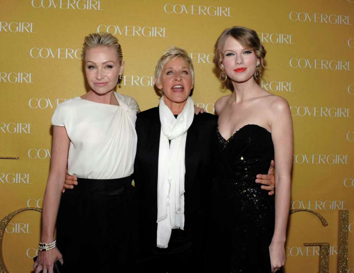 Actress Portia de Rossi, left, television personality Ellen DeGeneres, center, and singer Taylor Swift arrive at the COVERGIRL Cosmetics' 50th Anniversary Party in Los Angeles on Wednesday, Jan. 5, 2011. (AP Photo/Dan Steinberg)