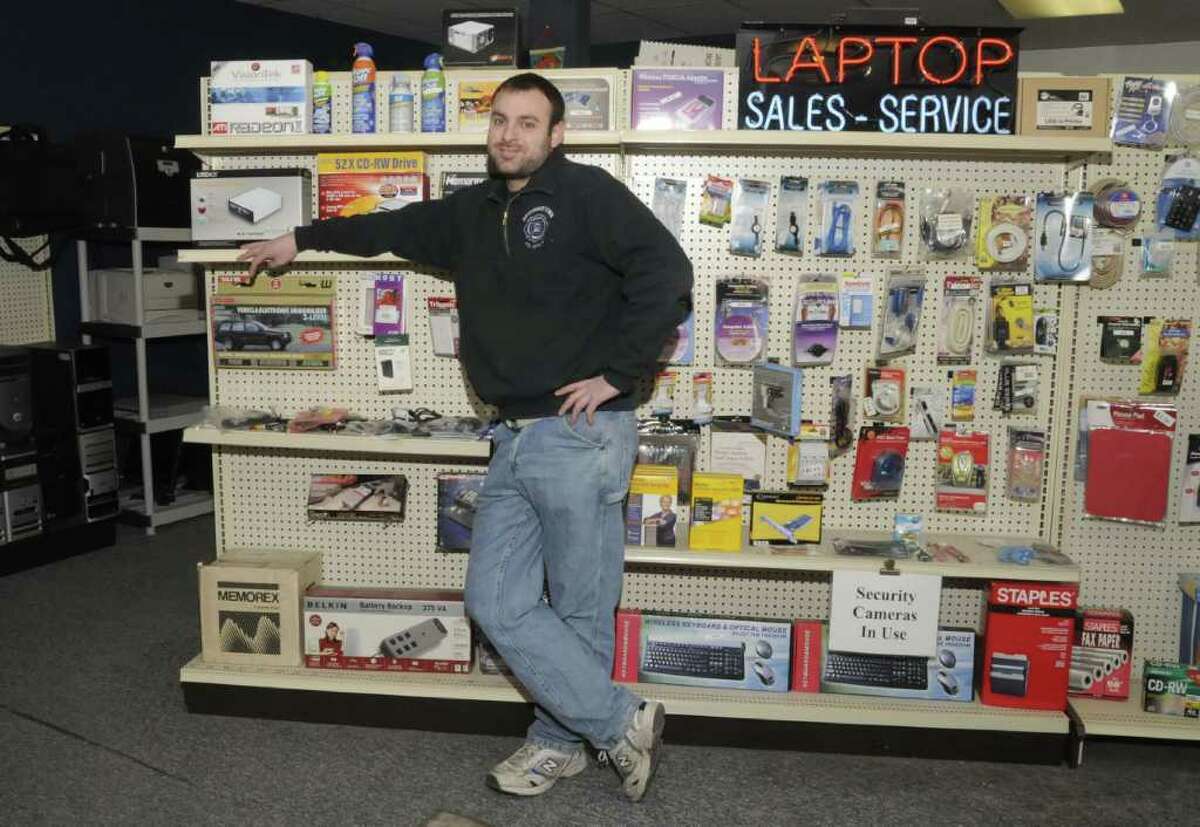 Joe Masso, owner of Liberty Computer Services in Newtown, at the accessories display in his showroom, on Thursday, Jan. 6, 2011.