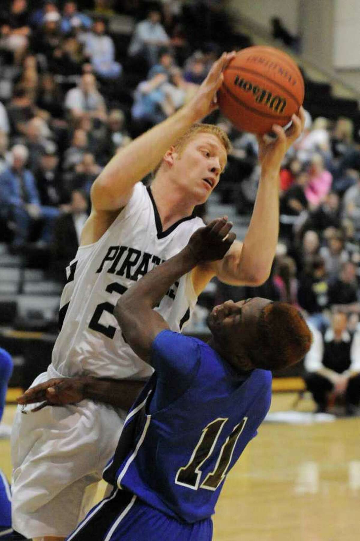 Vidor's Josh Aldridge pulls in the rebound over Ozen defender Keyione Blackmon during their District 20-4A game at Vidor on Friday. January 7, 2010 Valentino Mauricio/The Enterprise
