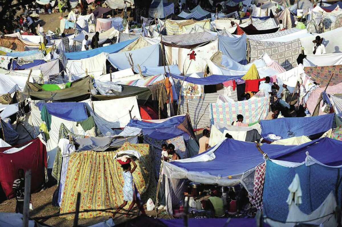 A large tent city has been set up for people displaced by the earthquake at the Petionville Club, at Delma 40B, in Port Au Prince, Haiti, Monday, Jan. 18, 2010. The U.S. Army is distributing food and water at the tent city. (AP Photo/Michael Laughlin, Sun-Sentinel) MANDATORY CREDIT 1/22/10 Citizen photo (contributed) = Destination Haiti. By Anne W. Semmes.