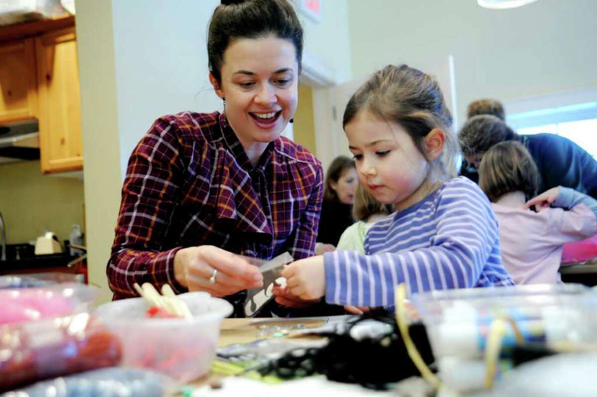 Rebecca Blackshaw helps her daughter Mim Hurley, 5, at the paper doll-making workshop to create wedding attire at the Greenwich Historical Society, in Cos Cob, on Sunday, Jan. 9, 2011.