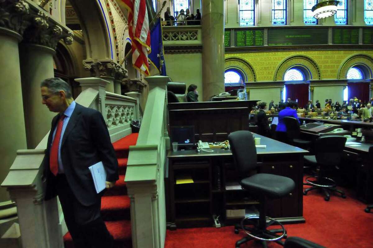 Assembly Speaker Sheldon Silver steps down from his seat at after Monday's opening day of the legislative session was adjourned in the Assembly chamber of the Capitol in Albany, NY on January 10, 2011. ( Philip Kamrass / Times Union )