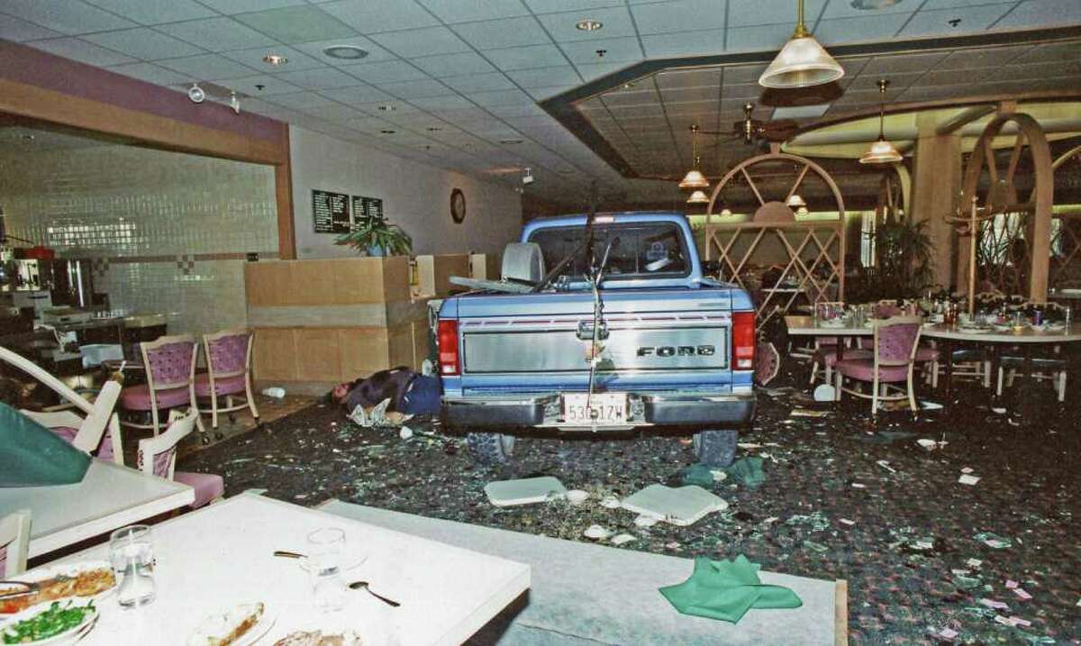 In this photo provided by Ron Franscell and The Department of Public Safety After driving his truck, shown here, through a Luby's Cafeteria in Killeen in 1991, George Hennard shot and killed 23 people and wounded 20 others.