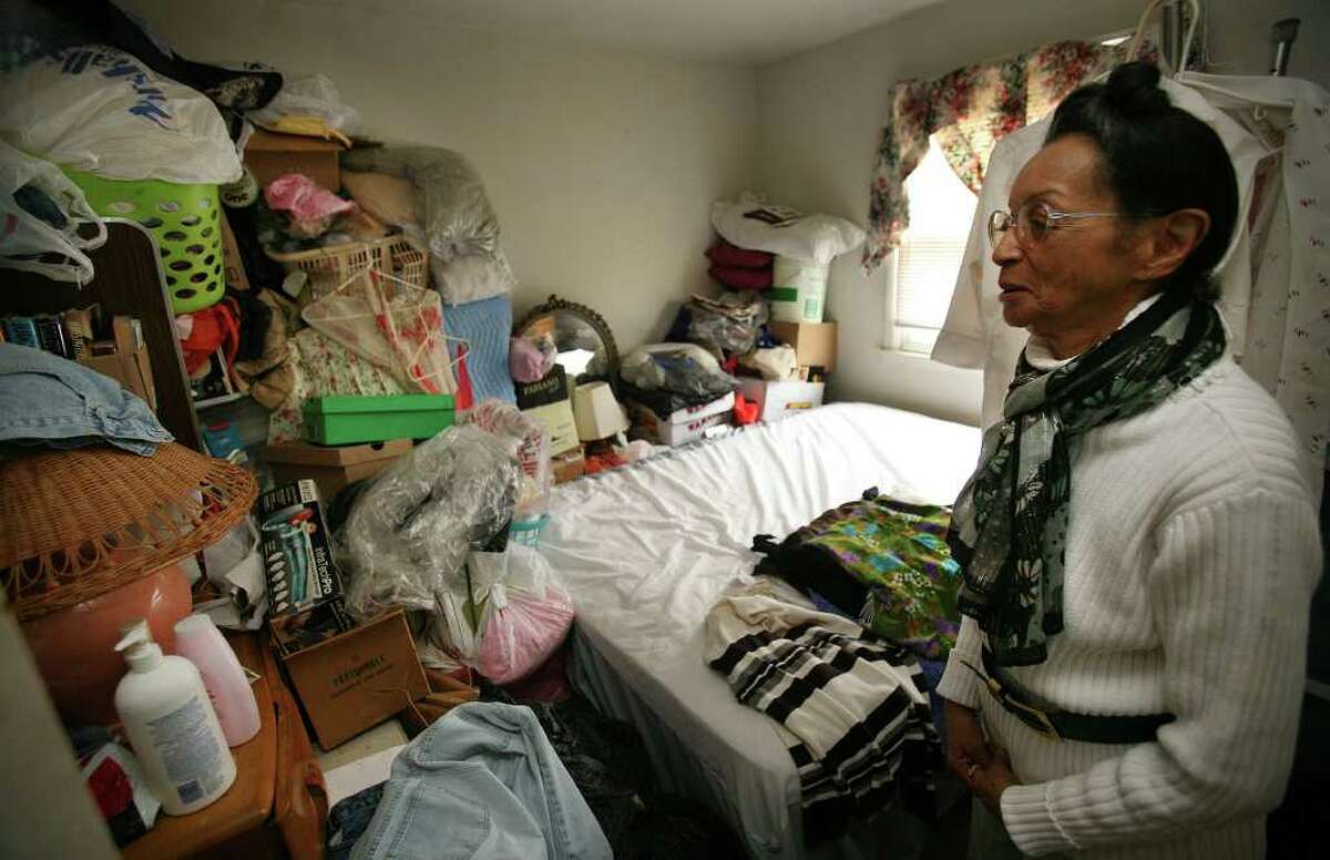 Carleen McDowell shows the most cluttered bedroom in her apartment at 95A Yaremich Drive in Bridgeport. McDowell, 74, hopes to donate most of her possessions to charity so that she can most into senior housing in Pennsylvania.
