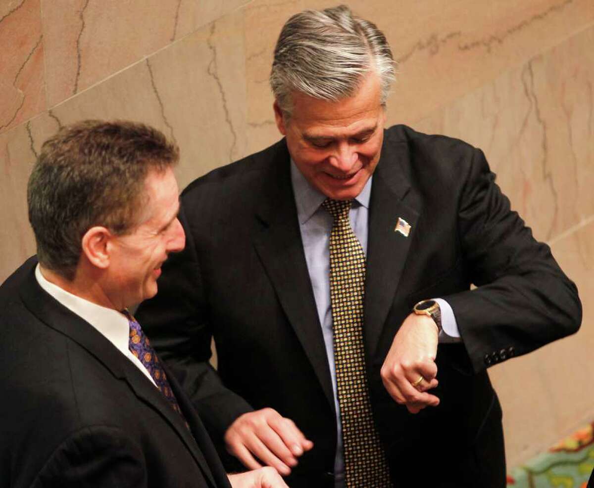 Lt. Gov. Robert Duffy, left, and Sen. Majority Leader Dean Skelos, R-Rockville Centre, talk Tuesday in the Senate chamber. As lawmakers face a huge state deficit, they will lose $6 a day each on expenses. (Mike Groll/Associated Press)