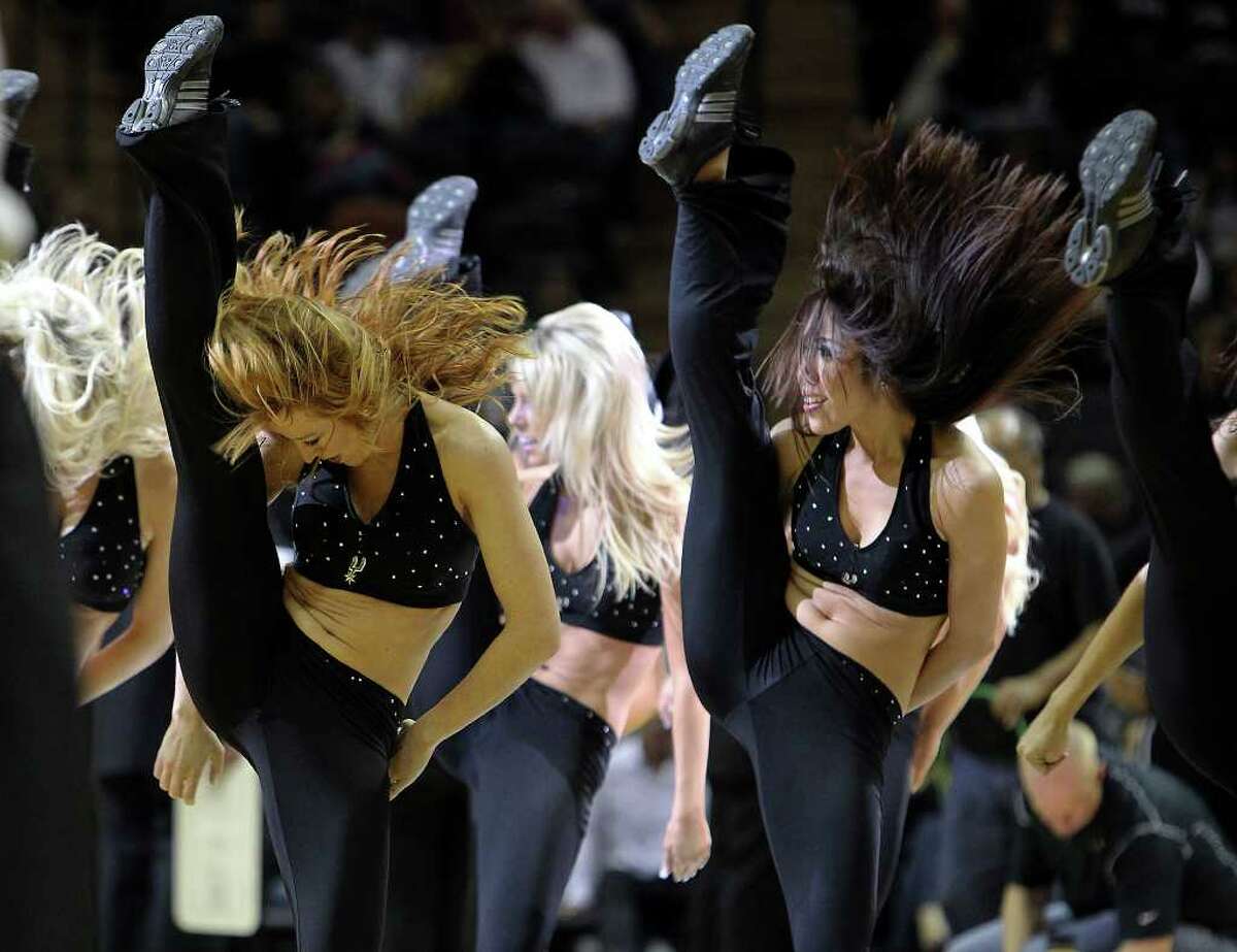 Spurs' SilverDancers high kick during a timeout performance in a game against the Dallas Mavericks at the AT&T Center on Friday, Jan. 14, 2011. Spurs defeated the Mavericks, 101-89. Kin Man Hui/kmhui@express-news.net