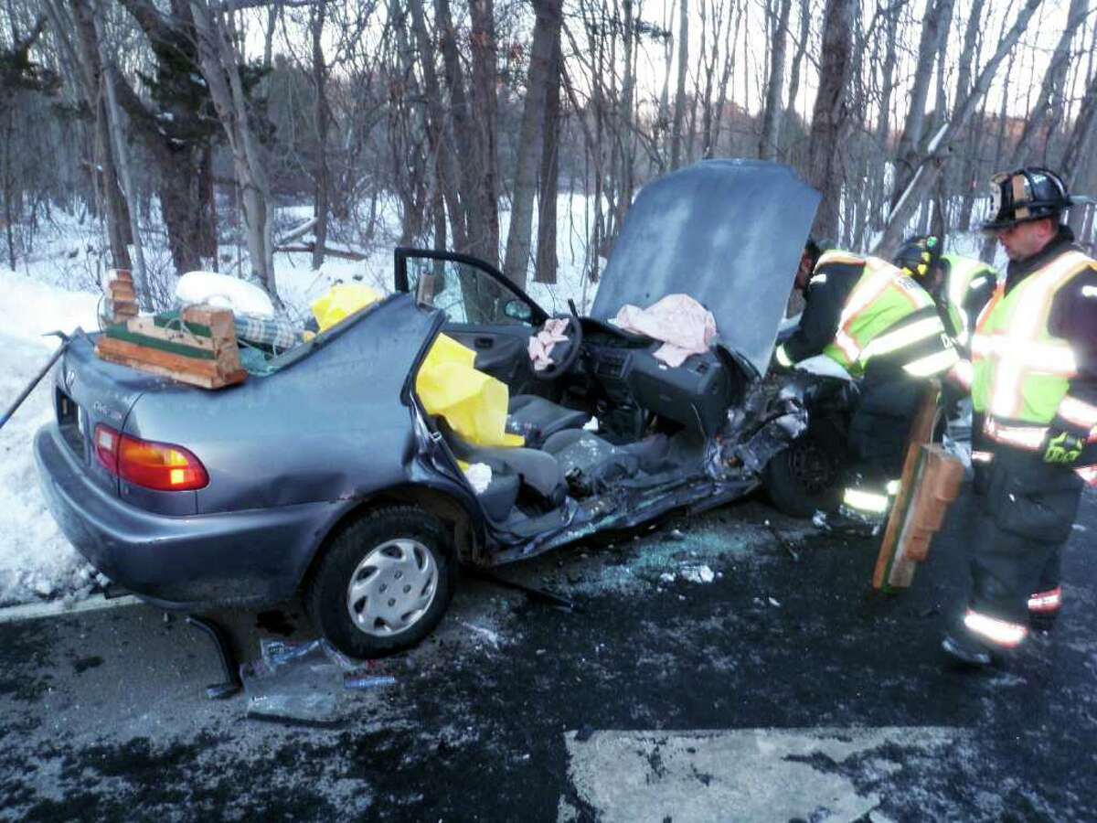 Two people had to be cut by firefighters from this Honda that crashed Sunday afternoon at Greens Farms Road and the Sherwood Island Connector.