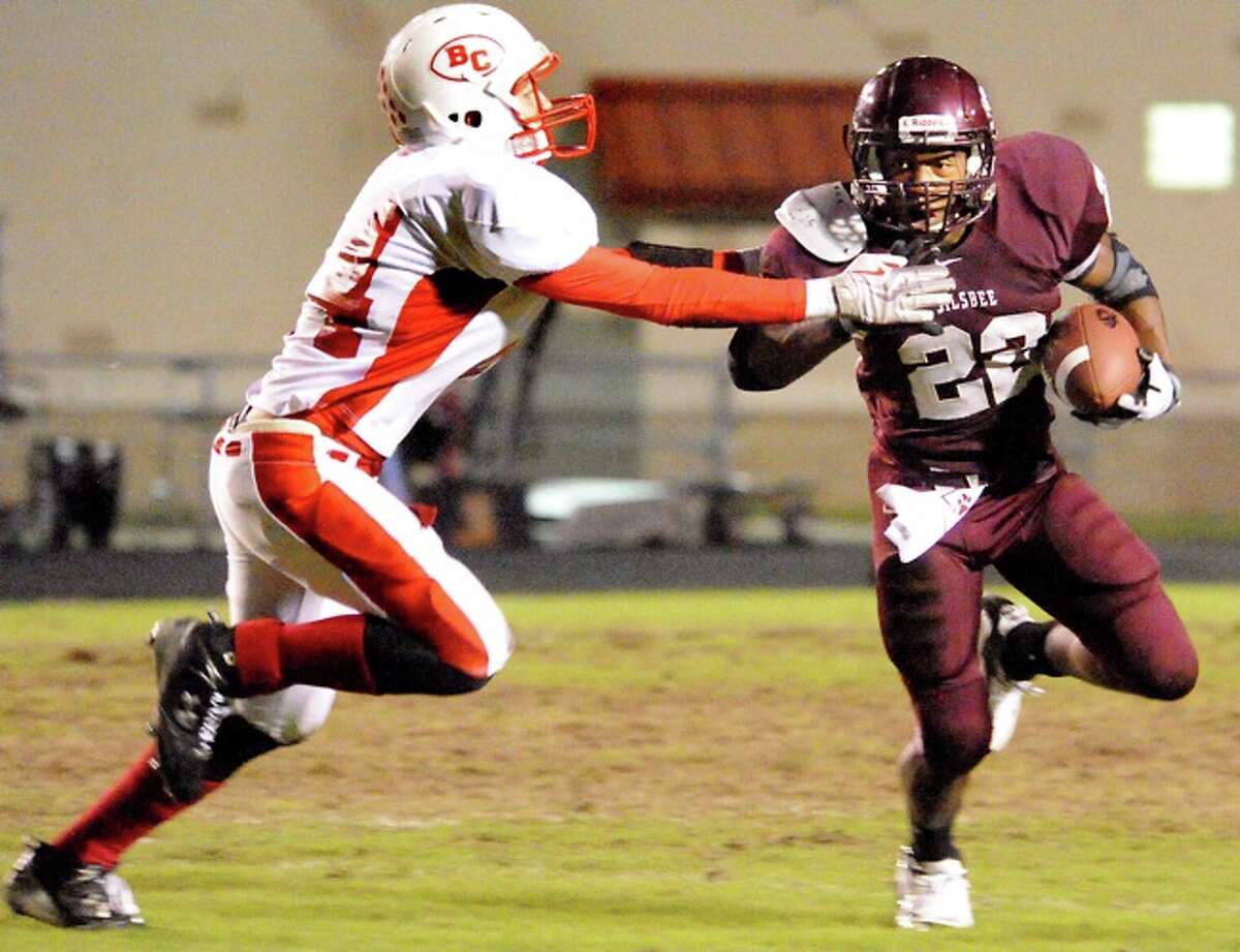 Bridge City's Evan Boren moves in to try to tackle Silsbee's Chris Barnes at Silsbee High School in Silsbee, Friday.