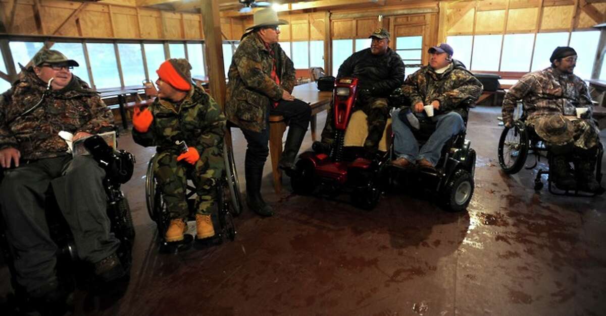 Veterans injured from the wars in Afghanistan and Iraq gather for orientation before a hunting trip begins at the Indian Springs Camp in Kountze. Enterprise file photo