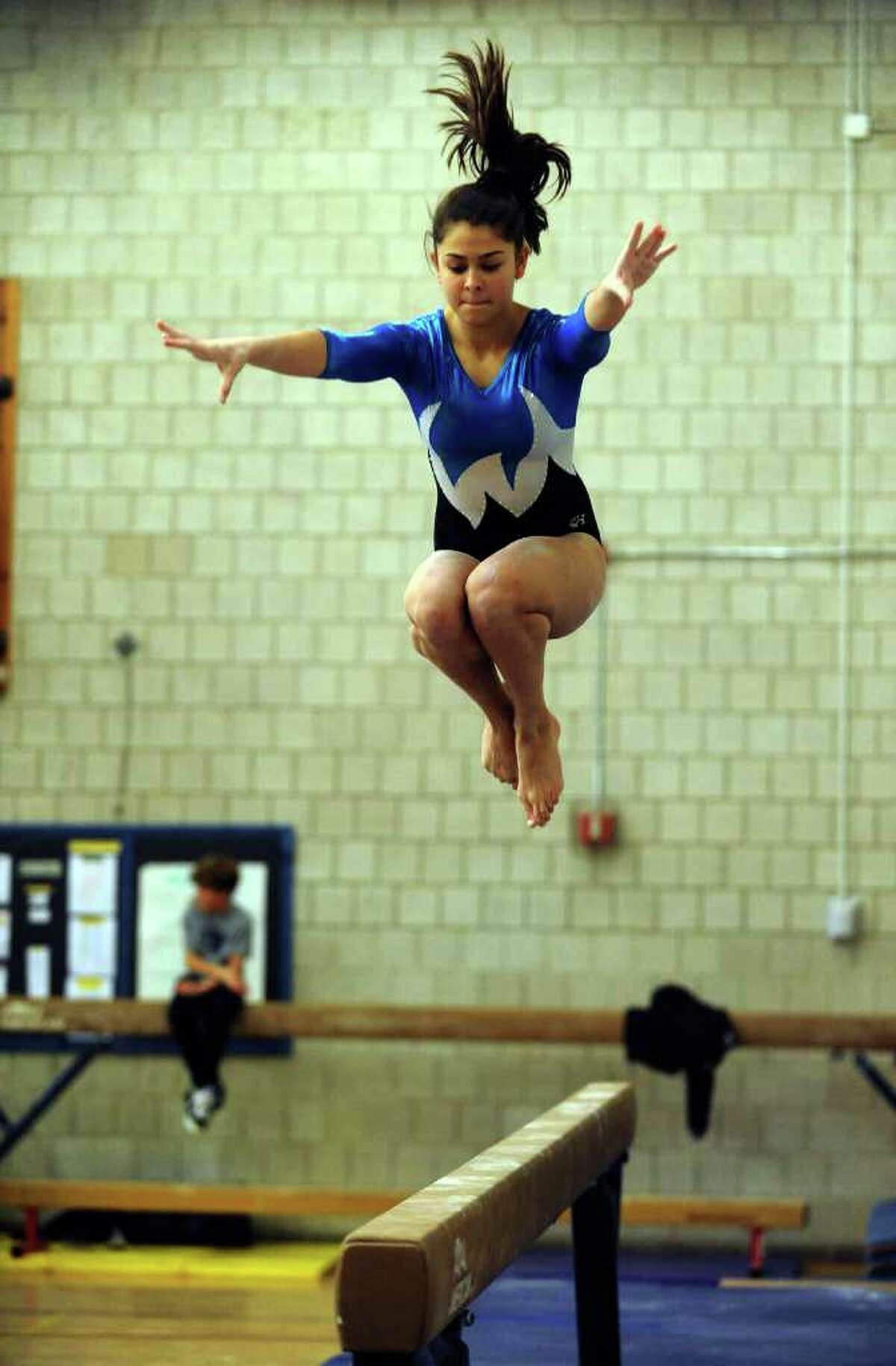 Staples' Lindsay Kledaisch competes on the balance beam, during a gymnastics meet against Pomperaug and Nonnewaug at Weston Middle School in Weston, Conn. on Friday January 14, 2011.