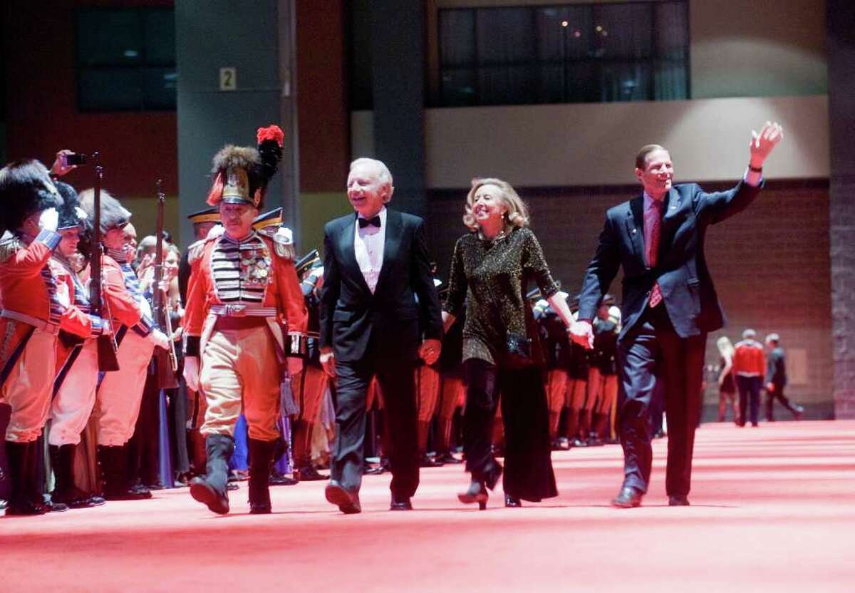 Democratic Senators Joseph Lieberman and Richard Blumental walk the red carpet with Lieberman's wife Hadassah at the 2011 Inaugural Ball at the Connecticut Convention Center in Hartford, Conn., Wednesday evening, January 5, 2011. The ball is hosted by the Board of Trustees of the First Company Governor's Foot Guard.