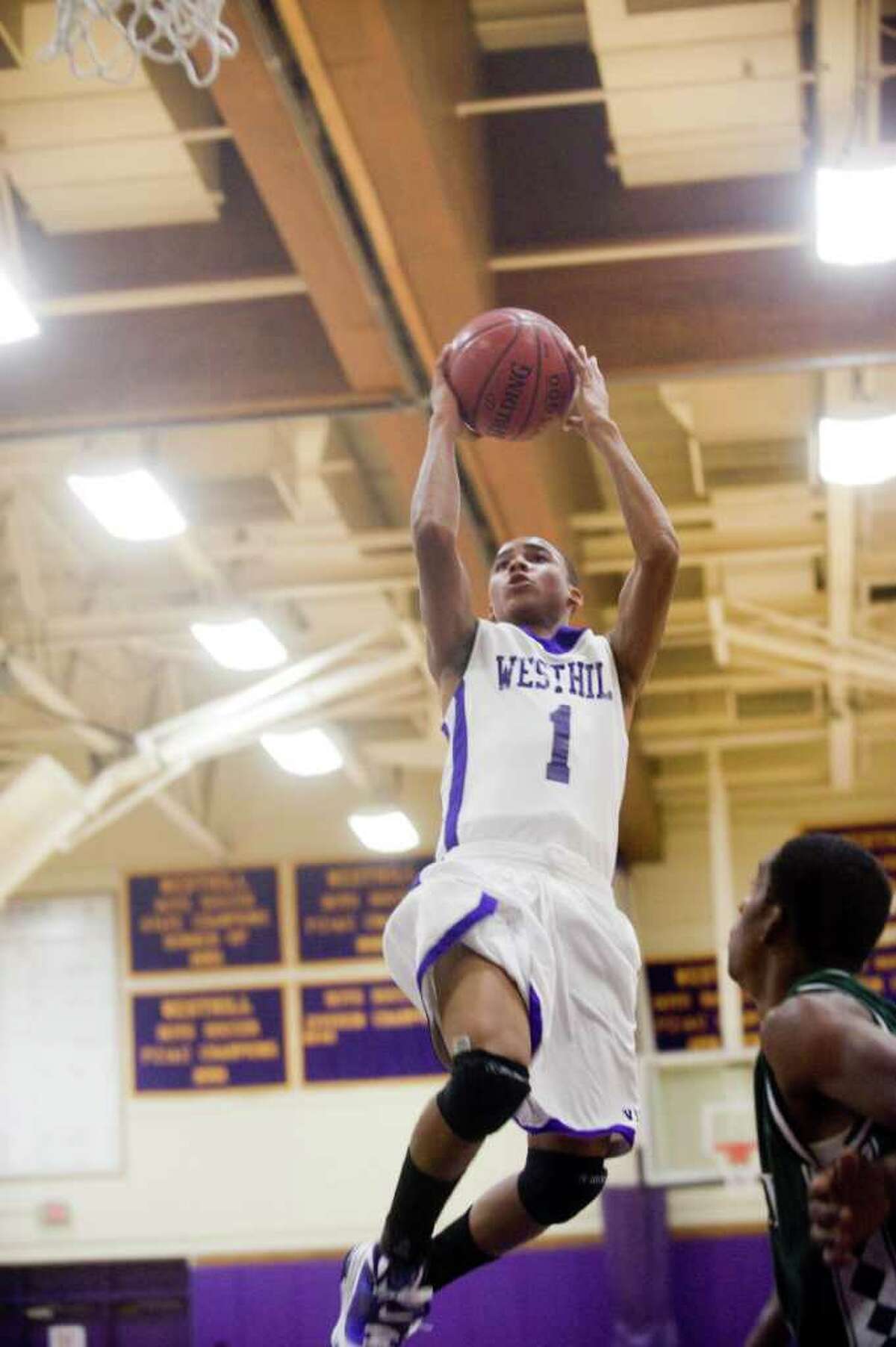 Westhill's Tony Dobbinson in action as Westhill High School hosts Norwalk High in a boys basketball game Wednesday, December 15, 2010.