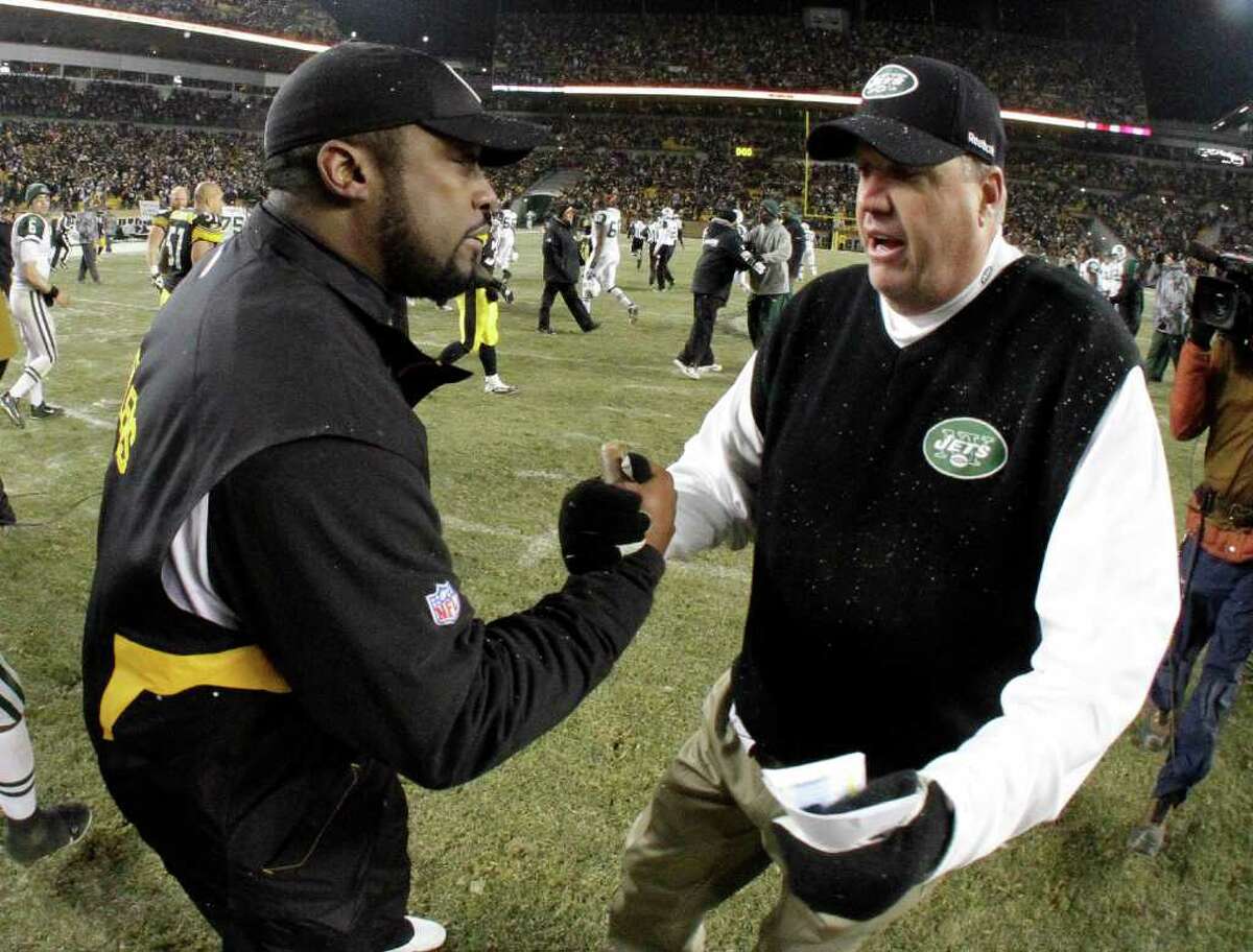 New York Jets coach Rex Ryan, right, and Pittsburgh Steelers coach Mike Tomlin meet after the Jets' 22-17 win in an NFL football game in Pittsburgh, Sunday, Dec. 19, 2010. (AP Photo/Gene J. Puskar)